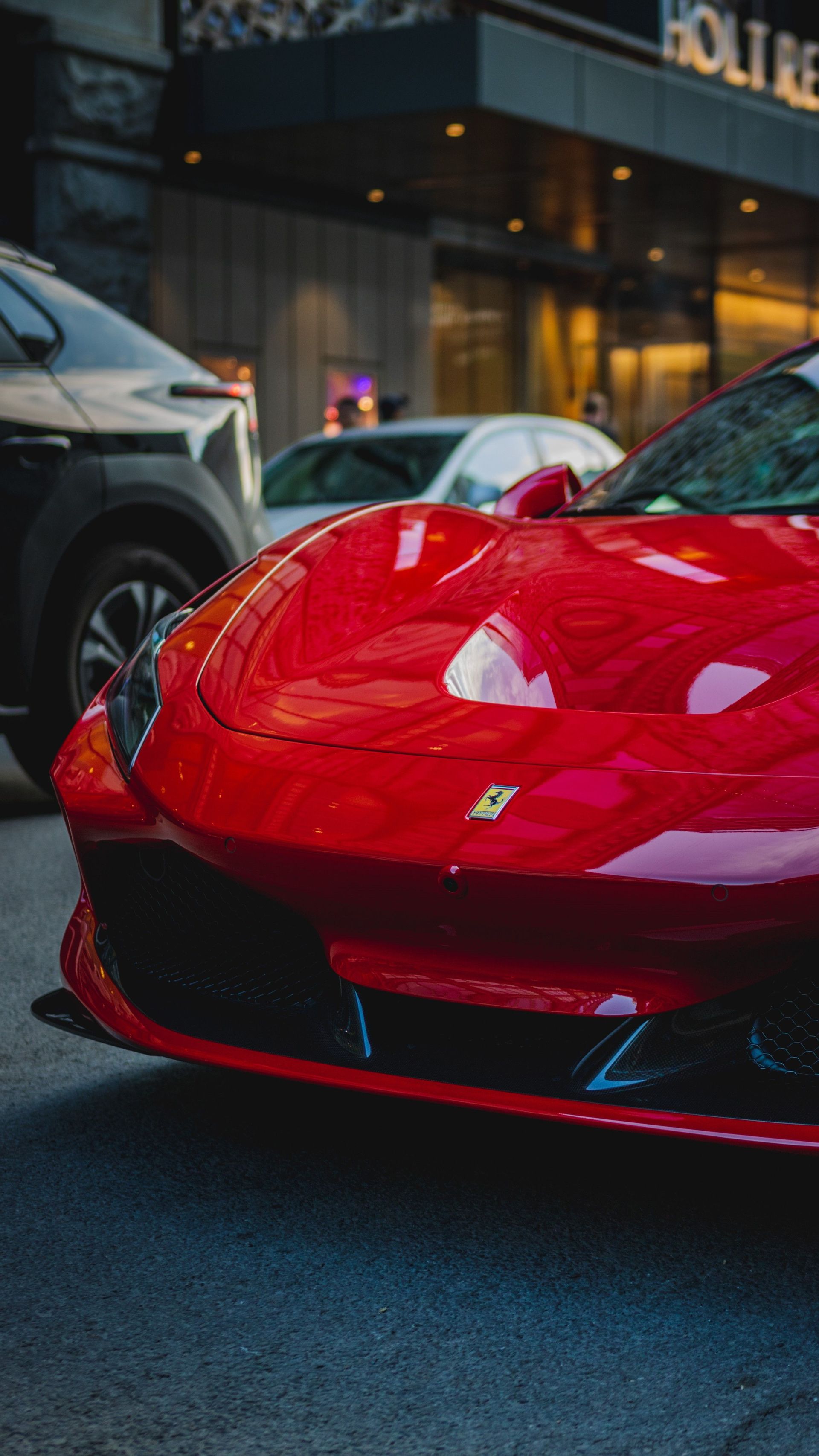 A striking red sports car parked in a bustling city environment, exuding luxury and style.